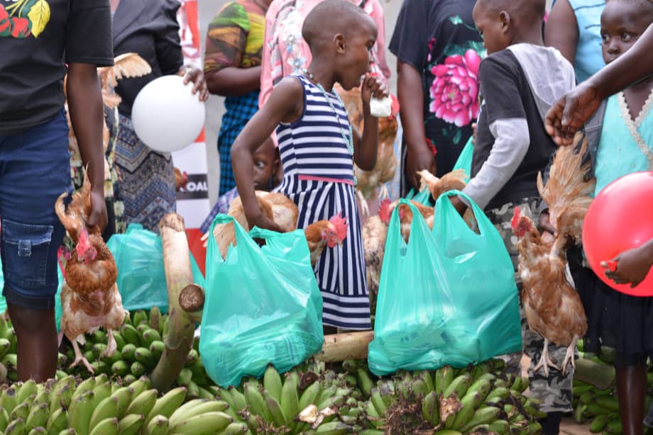 Children receiving chickens and supplies at MRF distribution event