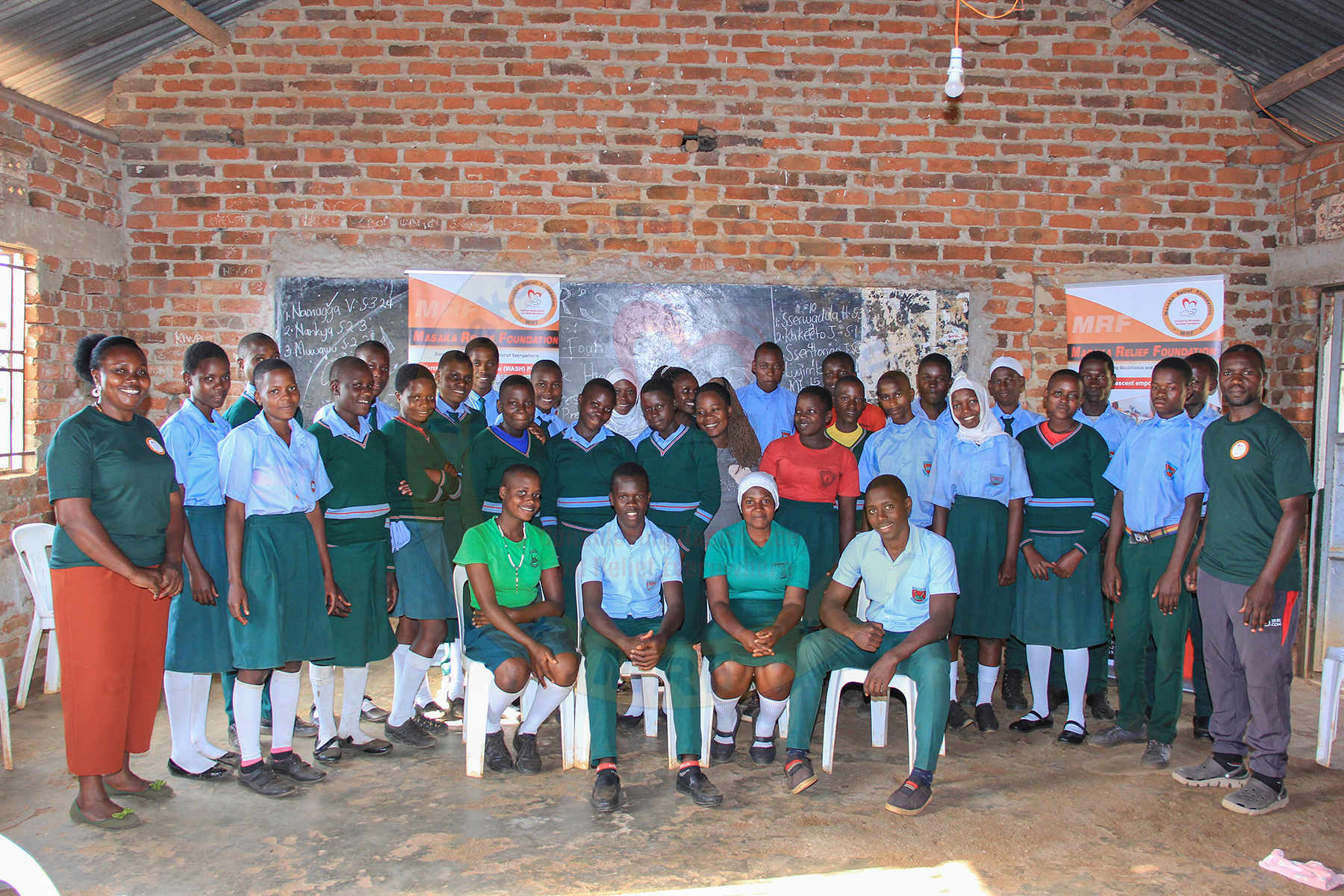 Group photo of students and MRF representatives at school